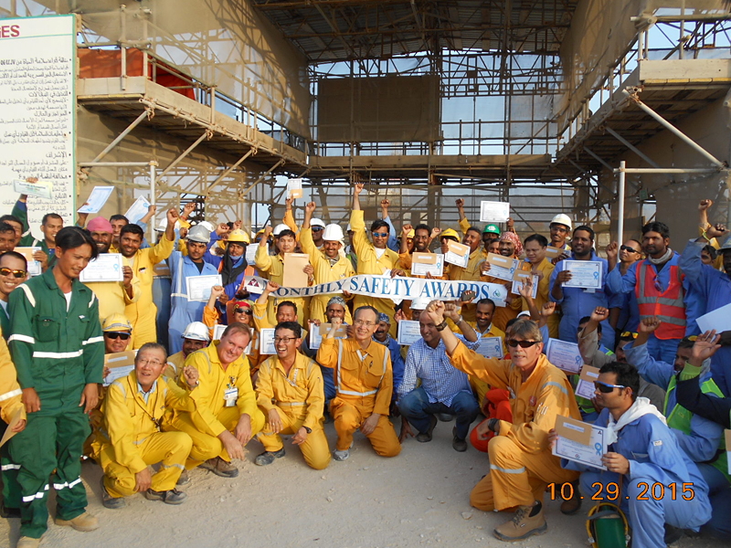 Ikeda shaking hands with workers